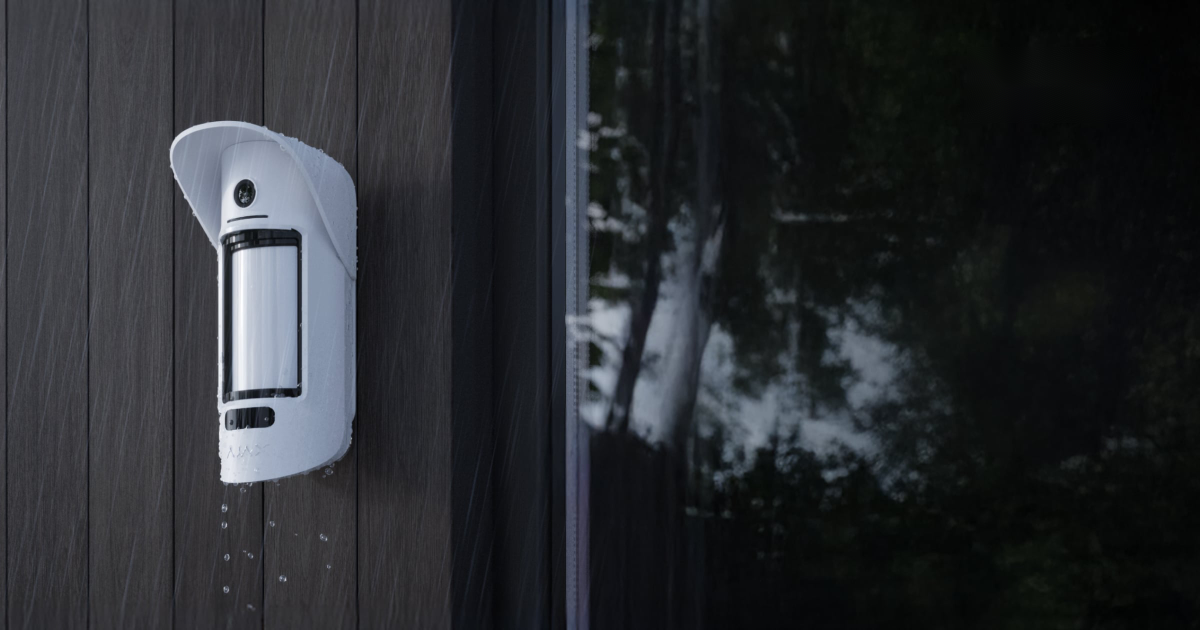 Ajax outdoor motion detector fitted to the exterior of a property